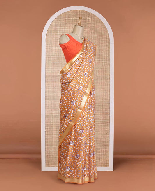 Orange kalamkari floral vine, and peacock printed silk saree, paisley zari motifs border, and striped pallu