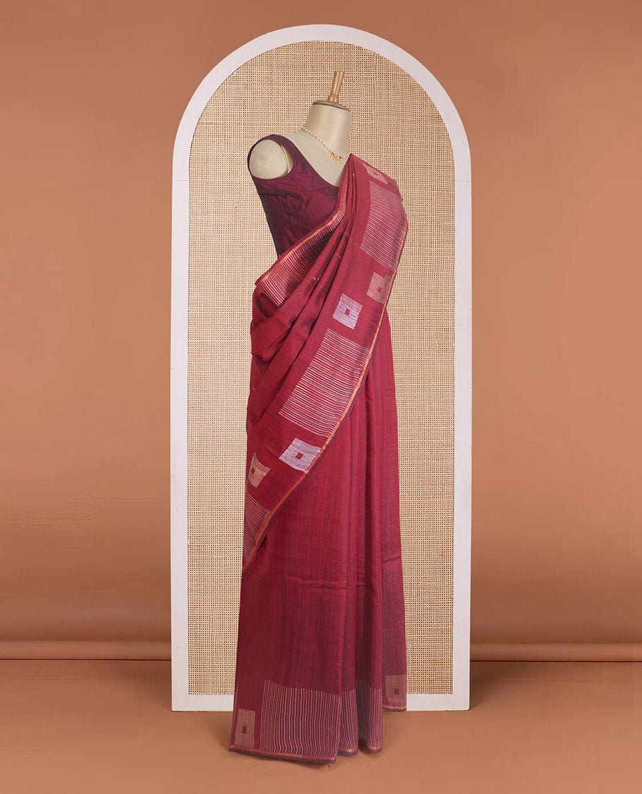 Maroon dupion silk saree with buttas, geometric patterned border, and zari rich pallu