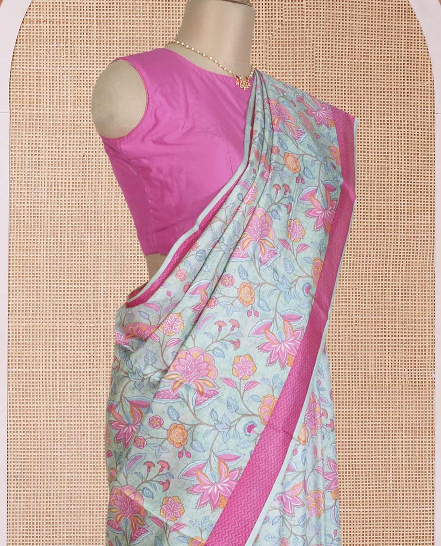Pastel blue floral motifs printed silk saree, contrast chevron border, and chevron printed pallu