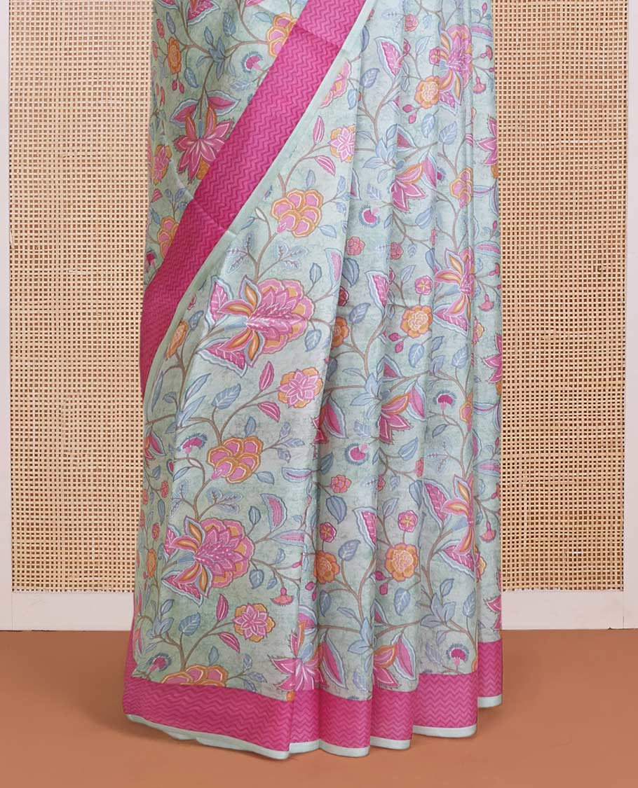 Pastel blue floral motifs printed silk saree, contrast chevron border, and chevron printed pallu