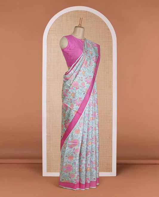 Pastel blue floral motifs printed silk saree, contrast chevron border, and chevron printed pallu