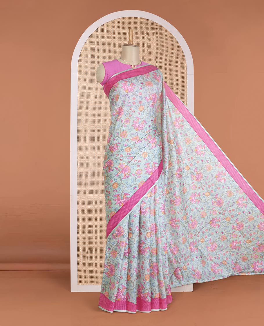 Pastel blue floral motifs printed silk saree, contrast chevron border, and chevron printed pallu