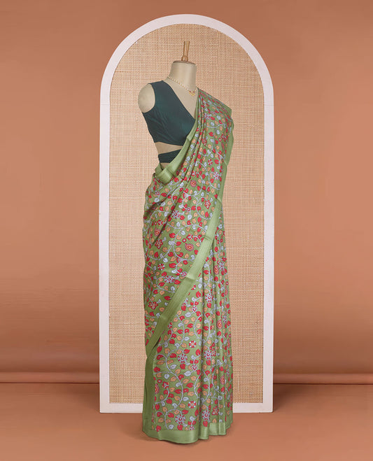 Green kalamkari floral vine printed silk saree, zari border, and pallu of stripes print