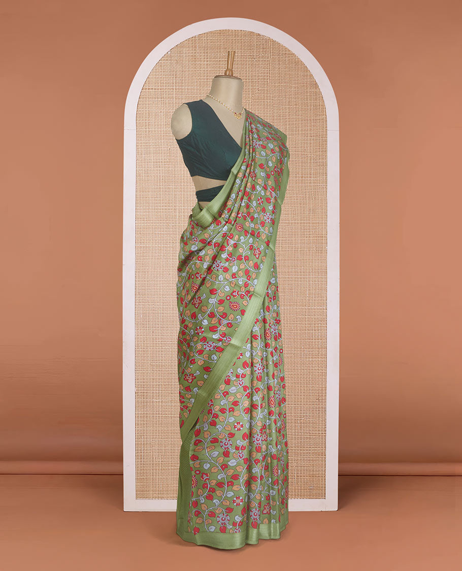 Green kalamkari floral vine printed silk saree, zari border, and pallu of stripes print