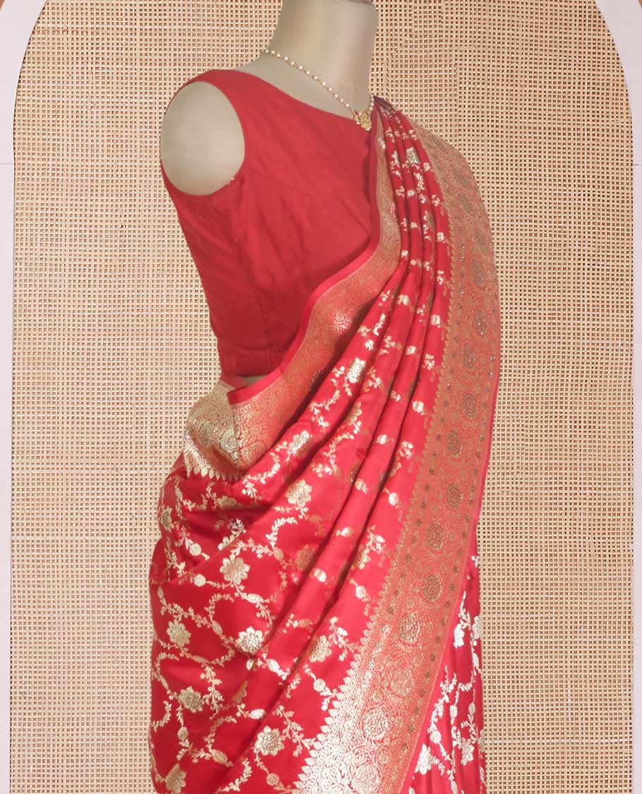 Red floral jaal jacquard with stone work Banaras Satin silk saree, floral creeper zari border, and pallu of thilkam design