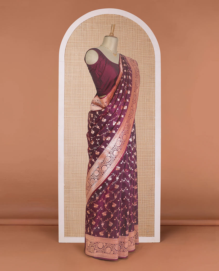Wine purple floral jaal jacquard with stone work Banaras Nylon silk saree, traditional zari border of floral creeper designs, and intricate pallu