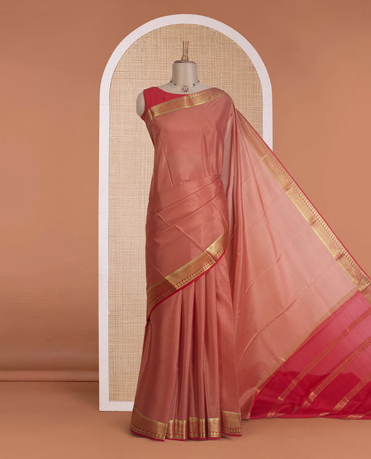 Peach plain Mysore silk saree, contrast traditional zari border of paisleys, and zari striped pallu