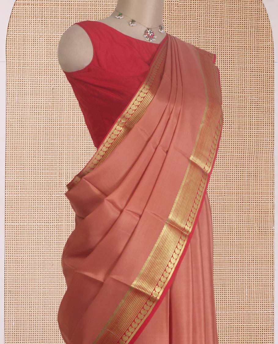 Peach plain Mysore silk saree, contrast traditional zari border of paisleys, and zari striped pallu