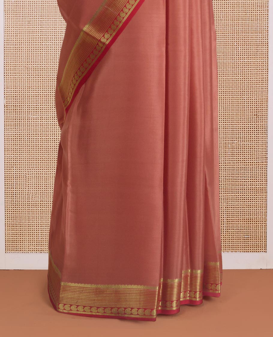 Peach plain Mysore silk saree, contrast traditional zari border of paisleys, and zari striped pallu