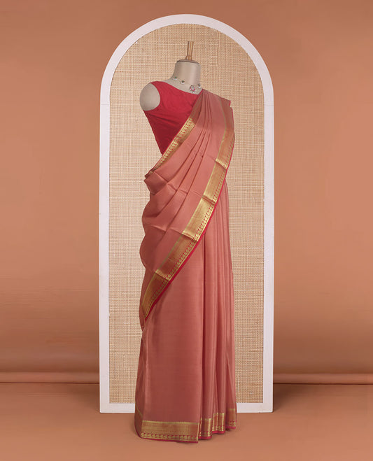 Peach plain Mysore silk saree, contrast traditional zari border of paisleys, and zari striped pallu