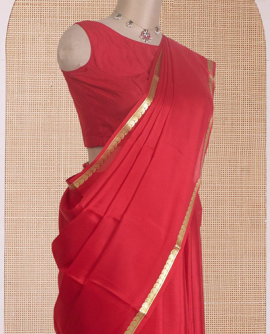 Red plain Mysore silk saree, zari border of paisleys, and zari striped pallu