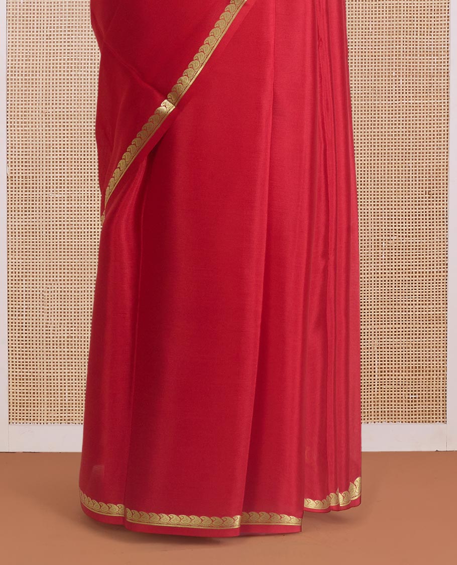 Red plain Mysore silk saree, zari border of paisleys, and zari striped pallu