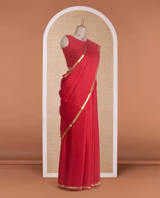 Red plain Mysore silk saree, zari border of paisleys, and zari striped pallu