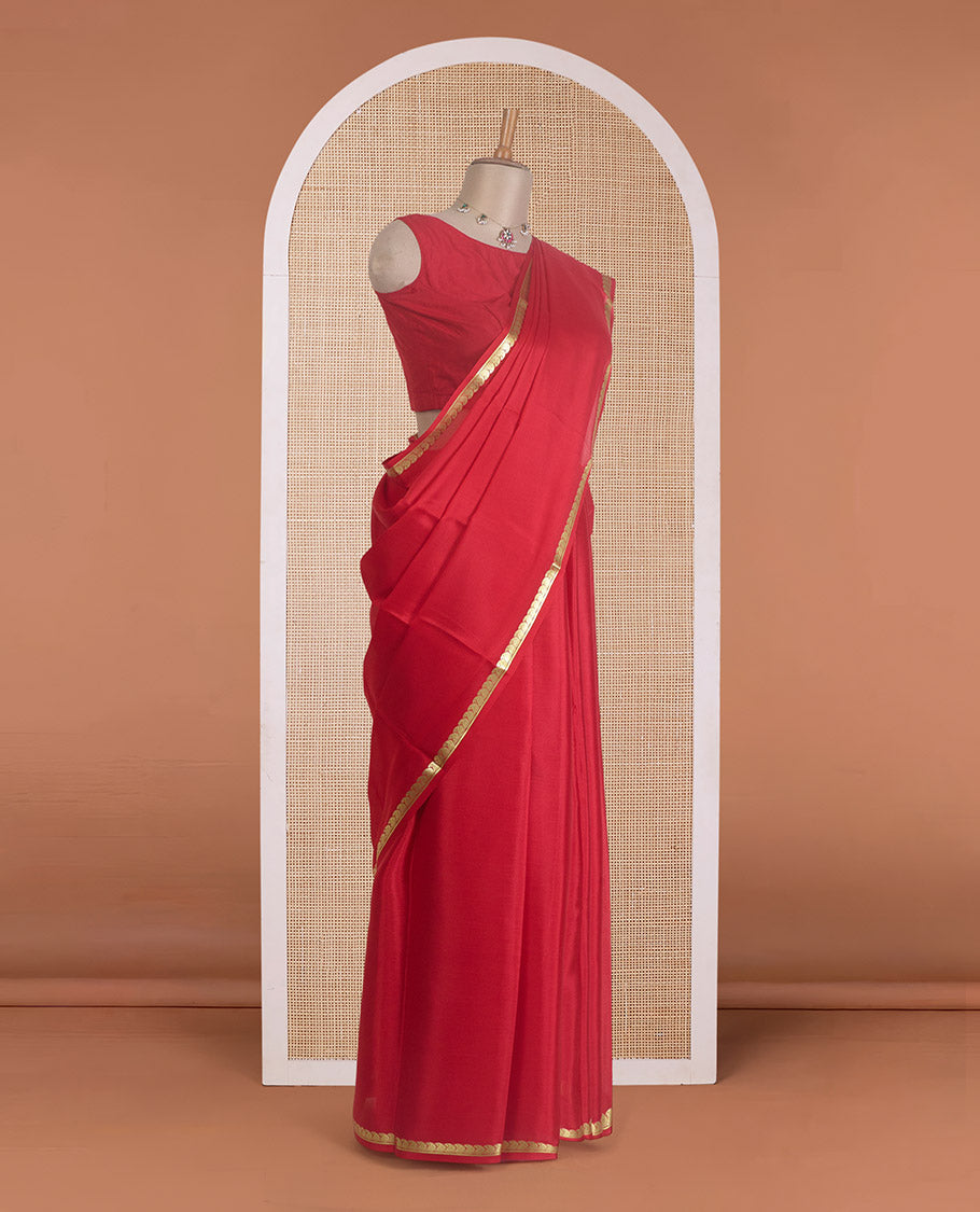 Red plain Mysore silk saree, zari border of paisleys, and zari striped pallu