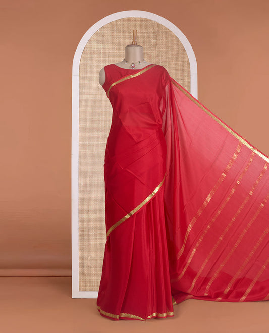 Red plain Mysore silk saree, zari border of paisleys, and zari striped pallu