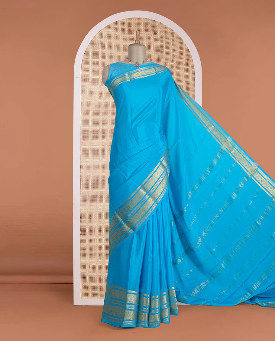 Blue zari buttas Mysore silk saree, zari border of chakram and floral creeper designs, and zari woven pallu