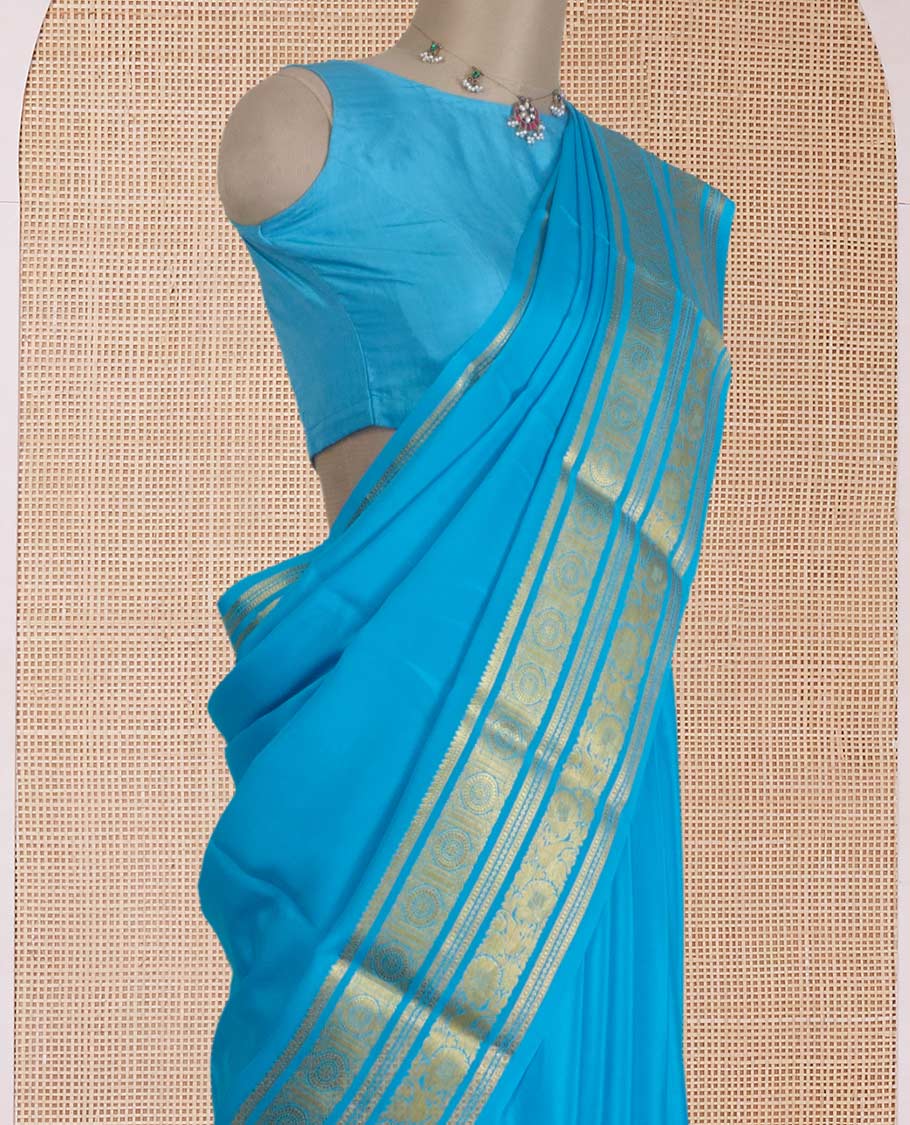 Blue zari buttas Mysore silk saree, zari border of chakram and floral creeper designs, and zari woven pallu