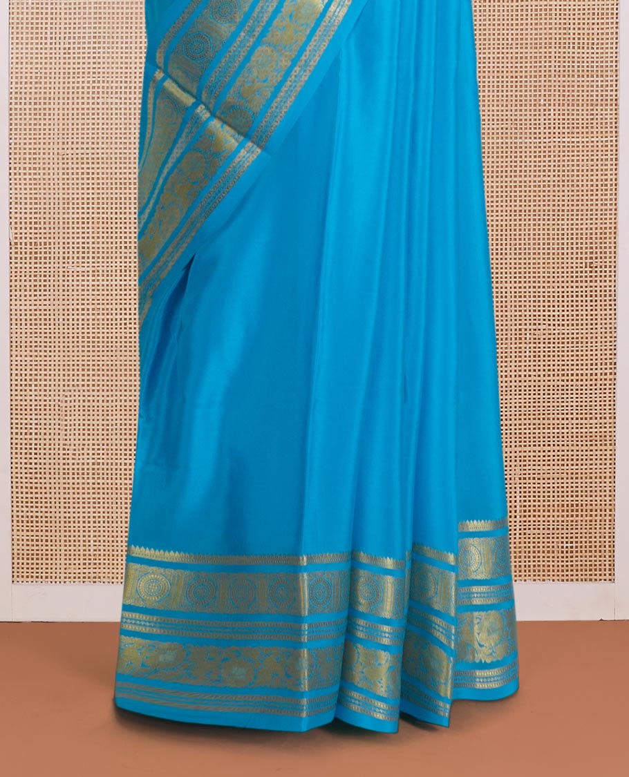 Blue zari buttas Mysore silk saree, zari border of chakram and floral creeper designs, and zari woven pallu