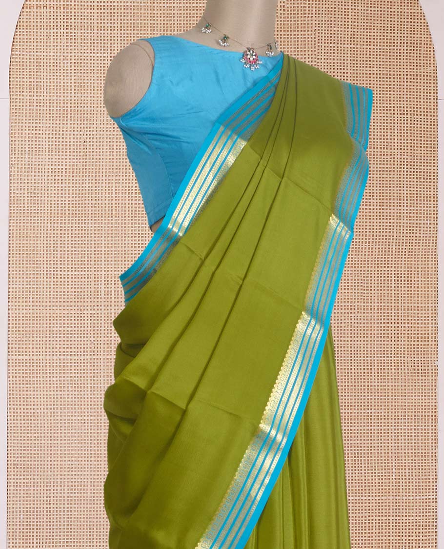 Parrot green plain Mysore silk saree, contrast traditional zari design border, and zari striped pallu