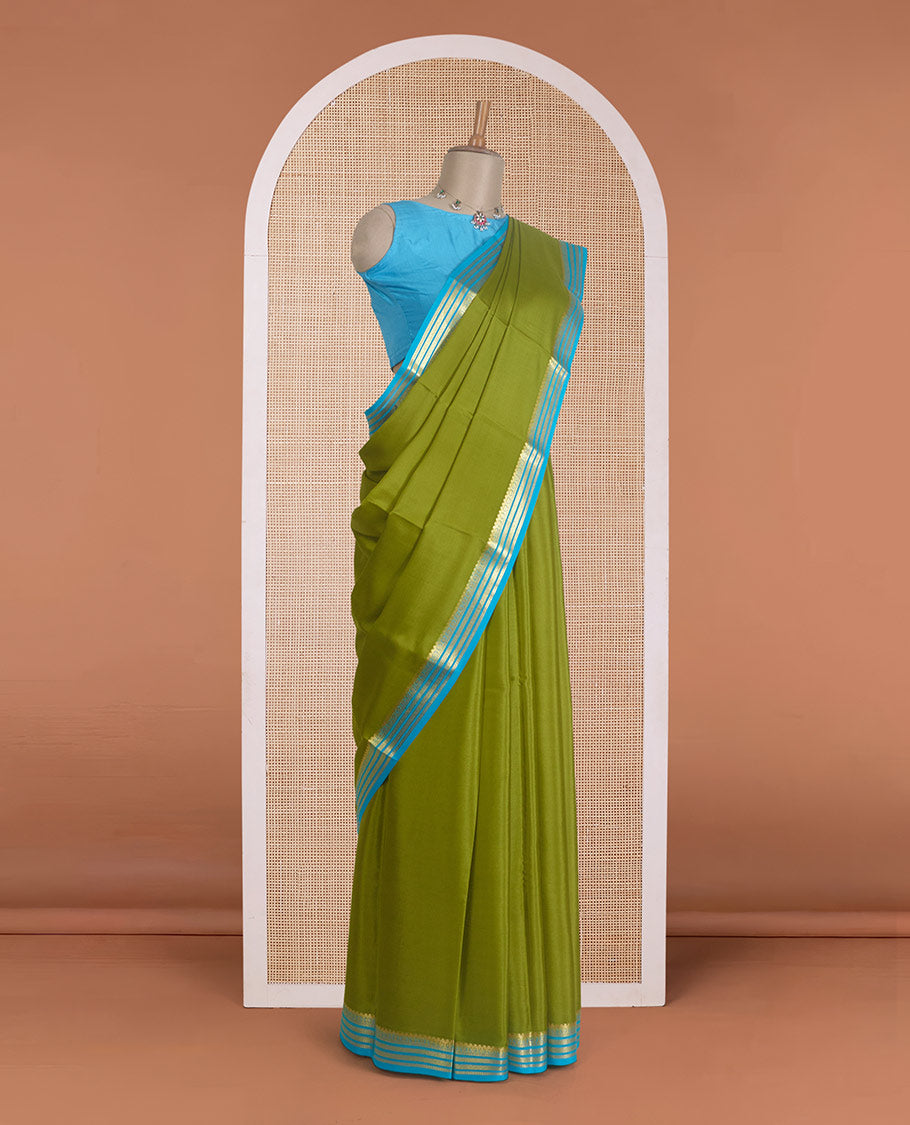 Parrot green plain Mysore silk saree, contrast traditional zari design border, and zari striped pallu