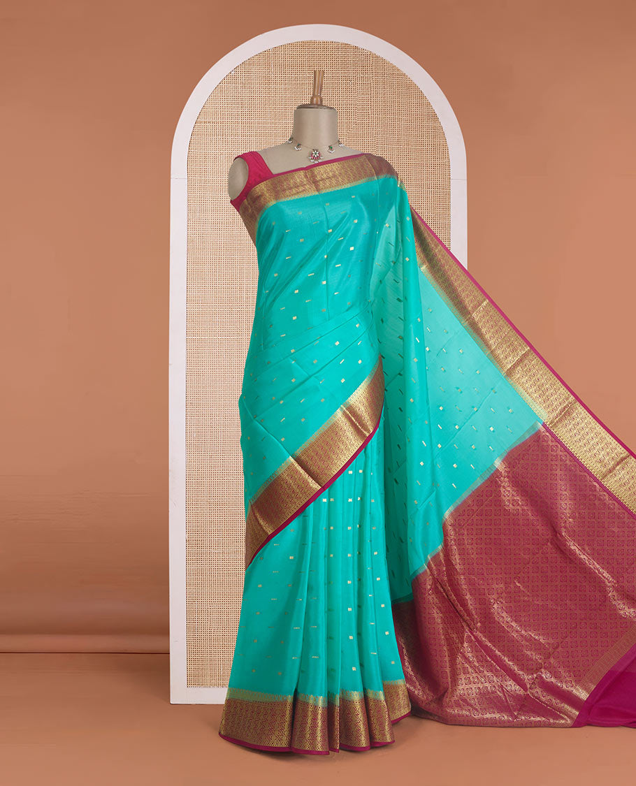 Green zari buttas Mysore silk saree, contrast floral design border, and pallu of jaal design