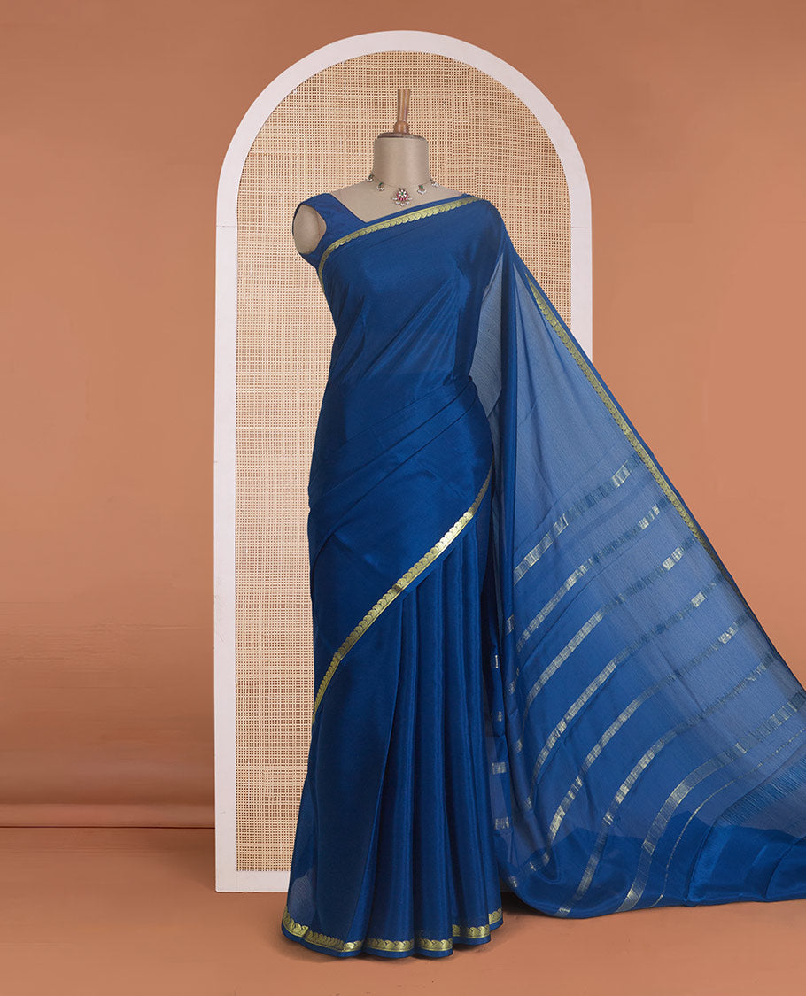 Navy blue plain Mysore silk saree, zari border of paisleys, and zari striped pallu