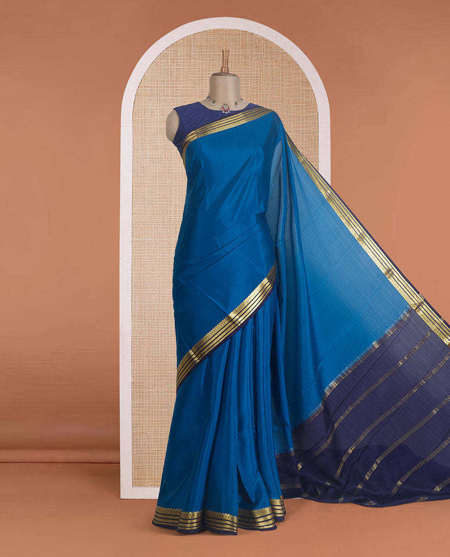 Blue plain Mysore silk saree, contrast traditional zari border, and zari striped pallu
