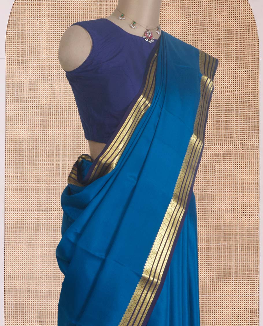 Blue plain Mysore silk saree, contrast traditional zari border, and zari striped pallu