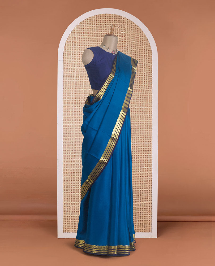 Blue plain Mysore silk saree, contrast traditional zari border, and zari striped pallu