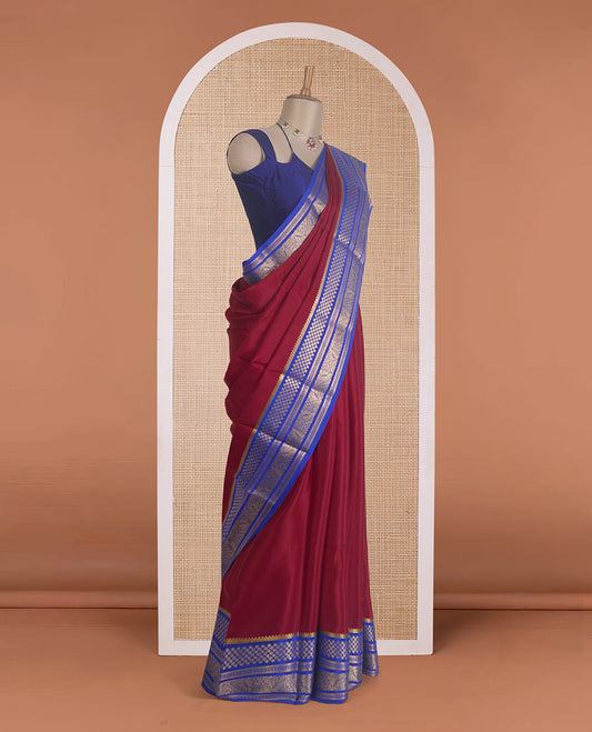 Maroon plain Mysore silk saree, contrast traditional zari designs steeped border, and zari striped pallu