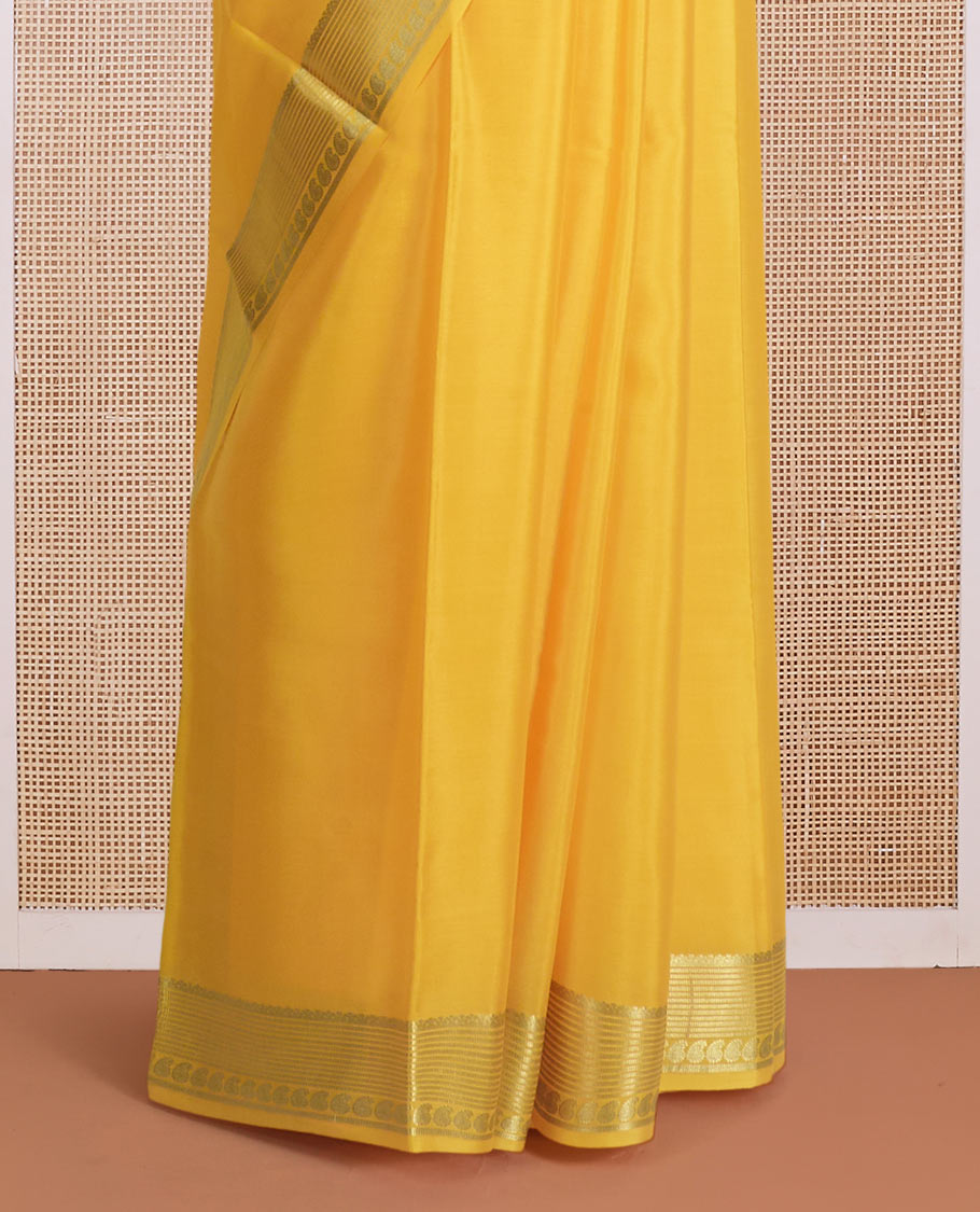 Yellow plain Mysore silk saree, traditional zari design steeped border, and zari striped pallu
