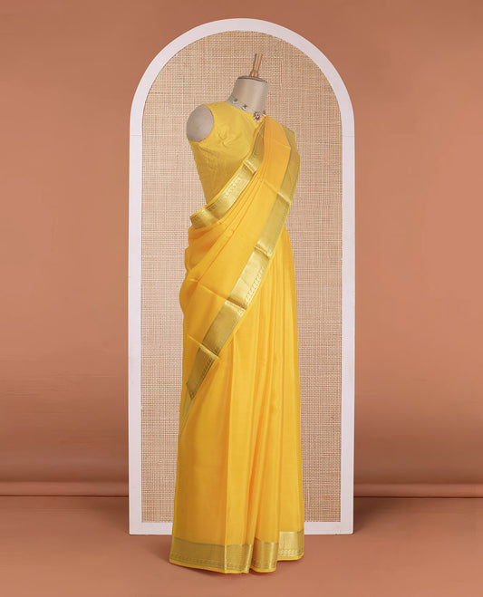 Yellow plain Mysore silk saree, traditional zari design steeped border, and zari striped pallu