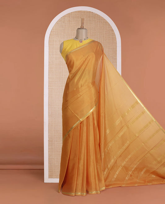 Mustard plain Mysore silk saree, traditional zari border, and zari striped pallu