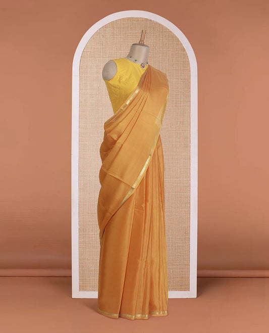 Mustard plain Mysore silk saree, traditional zari border, and zari striped pallu