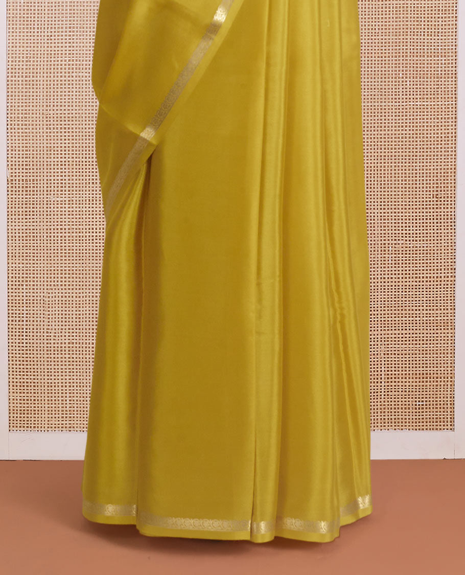 Yellow plain Mysore silk saree, traditional zari border, and zari striped pallu