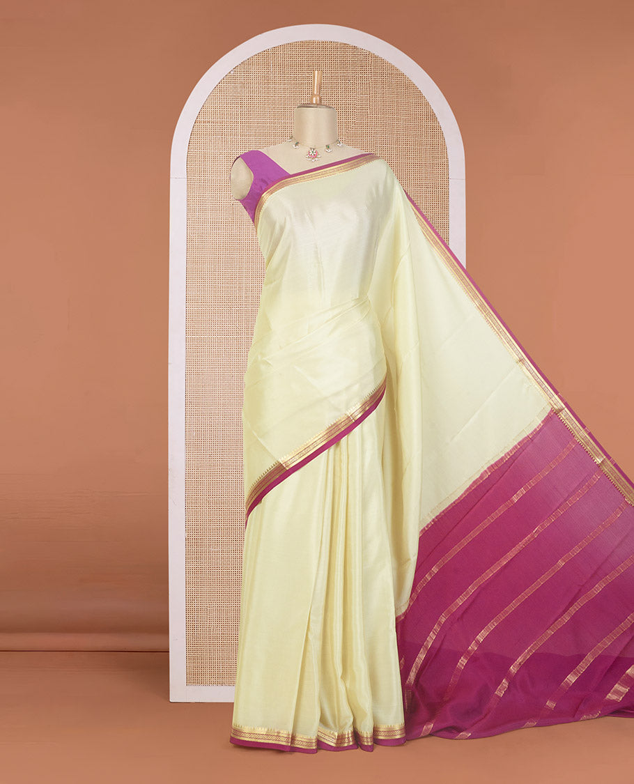 Cream plain Mysore silk saree, contrast temple traditional zari border, and zari striped pallu