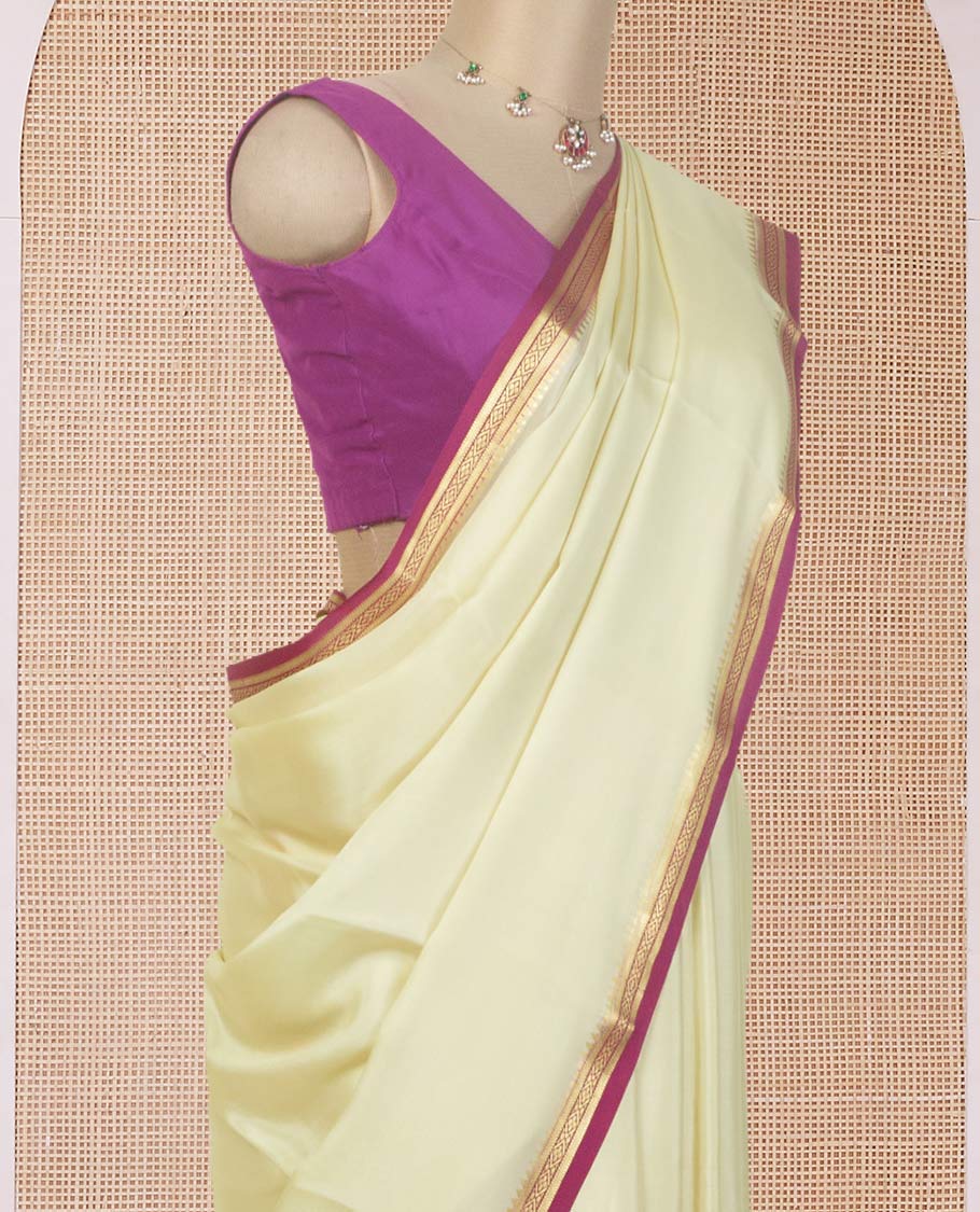 Cream plain Mysore silk saree, contrast temple traditional zari border, and zari striped pallu