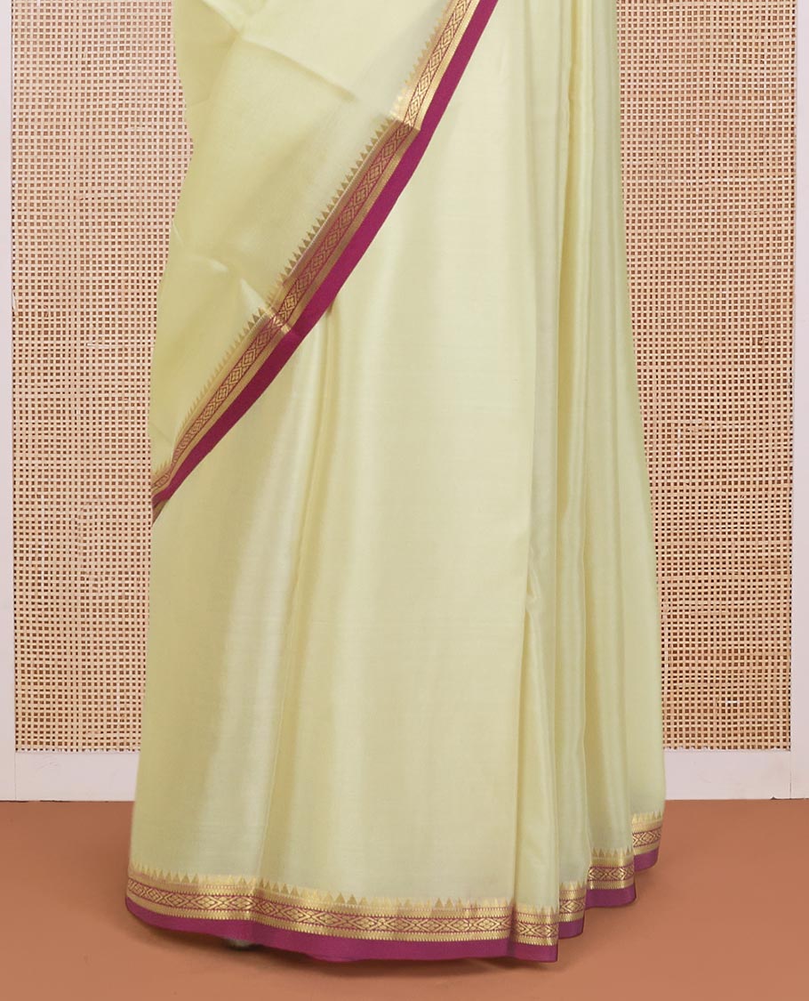 Cream plain Mysore silk saree, contrast temple traditional zari border, and zari striped pallu