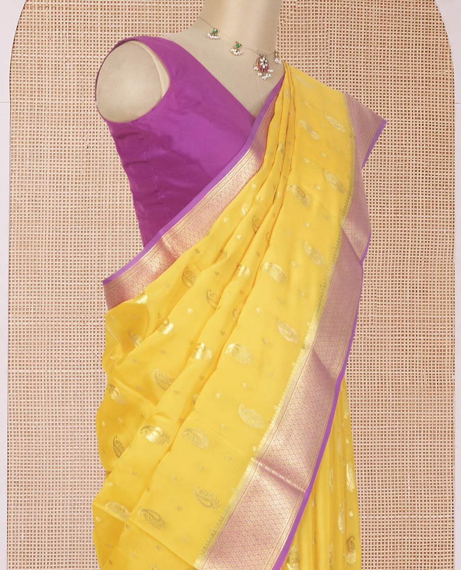 Yellow paisley buttas Mysore silk saree, contrast traditional zari border, and jaal design pallu