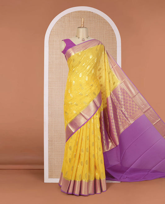 Yellow paisley buttas Mysore silk saree, contrast traditional zari border, and jaal design pallu