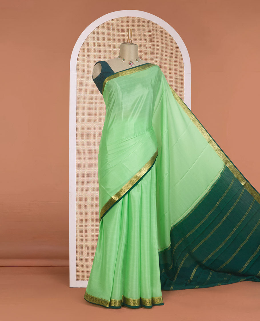 Pista green plain Mysore silk saree, contrast zari border of traditional designs, and zari striped pallu