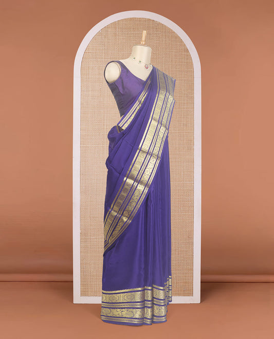 Navy blue plain Mysore silk saree, traditional zari design steeped border, and zari striped pallu