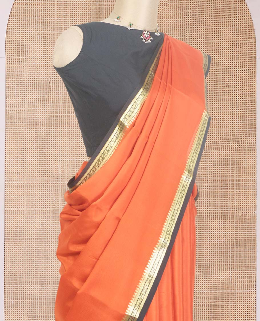 Orange plain Mysore silk saree, contrast traditional zari design border, and zari striped pallu