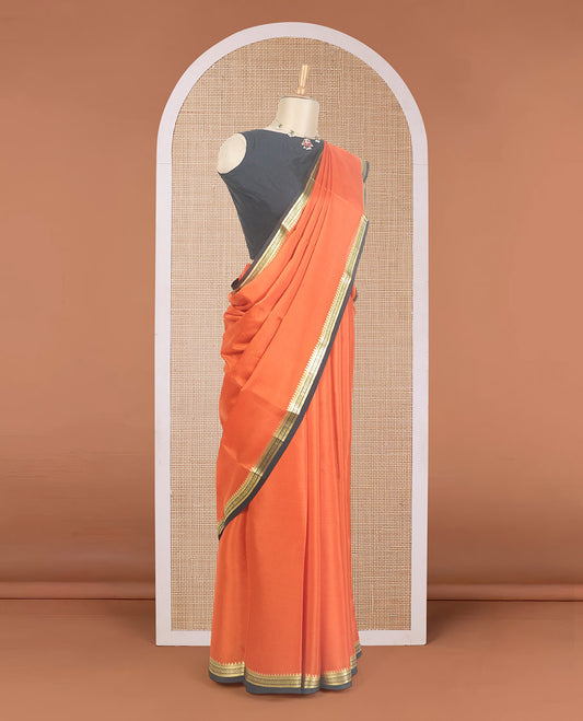 Orange plain Mysore silk saree, contrast traditional zari design border, and zari striped pallu
