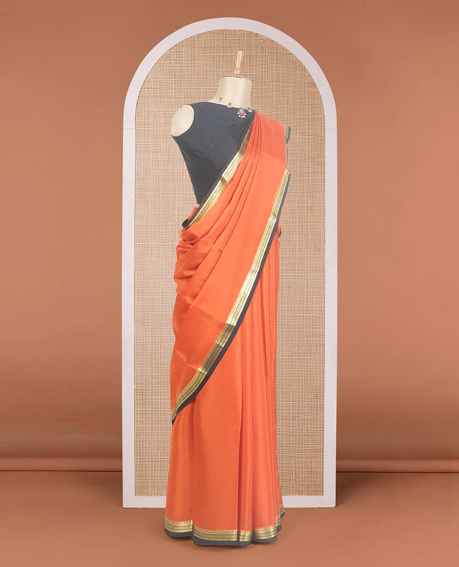 Orange plain Mysore silk saree, contrast traditional zari design border, and zari striped pallu