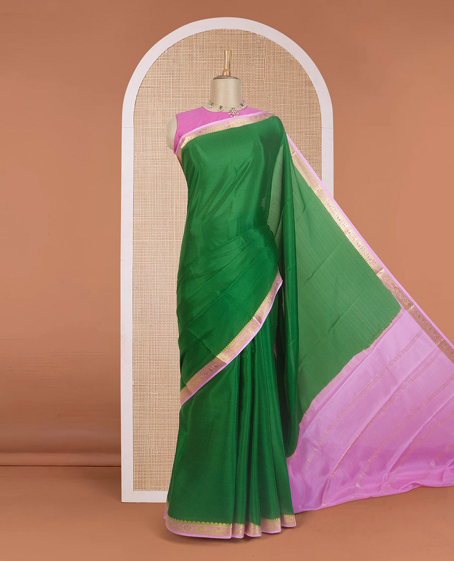 Green plain Mysore silk saree, contrast traditional zari design border, and zari striped pallu