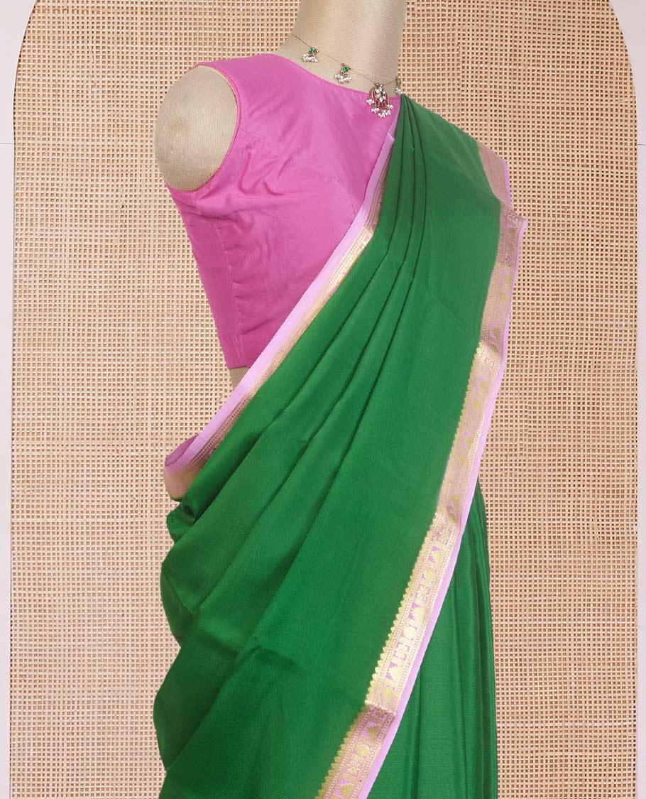 Green plain Mysore silk saree, contrast traditional zari design border, and zari striped pallu