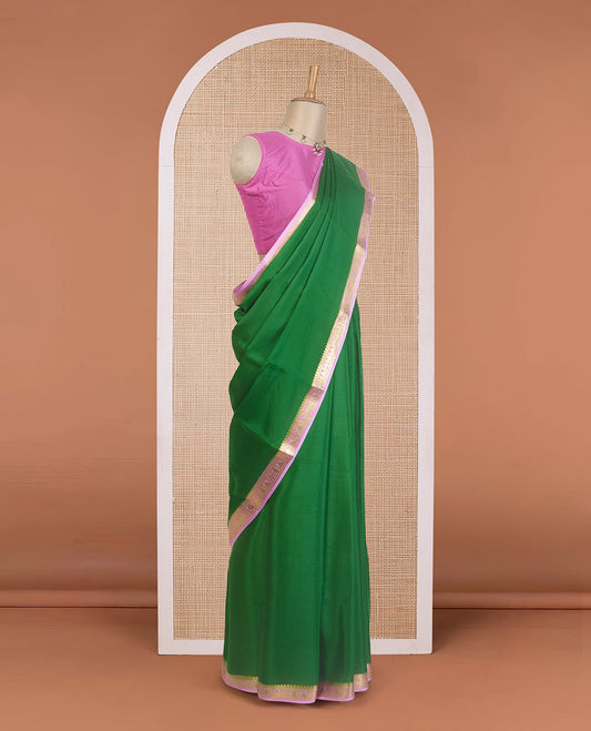 Green plain Mysore silk saree, contrast traditional zari design border, and zari striped pallu