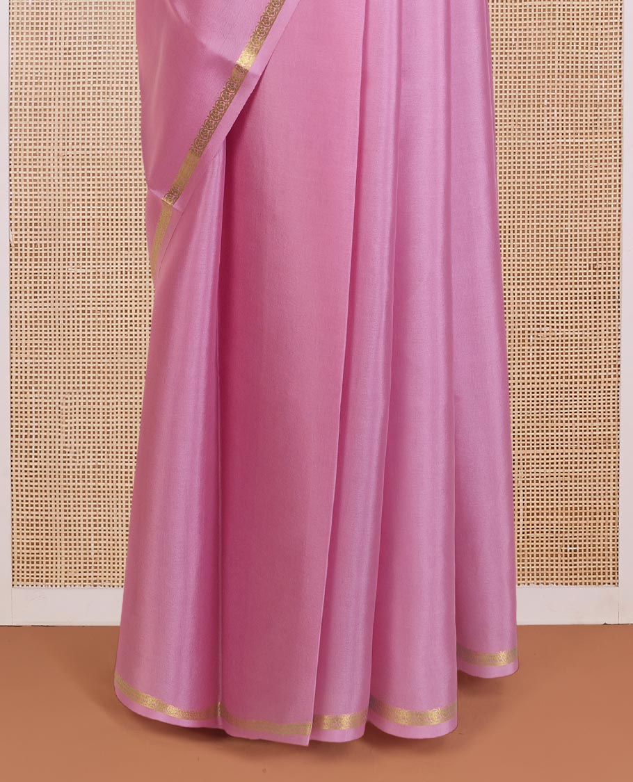 Flamingo pink plain Mysore silk saree, floral creeper zari border, and zari striped pallu