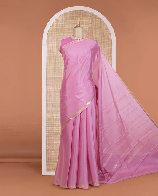 Flamingo pink plain Mysore silk saree, floral creeper zari border, and zari striped pallu